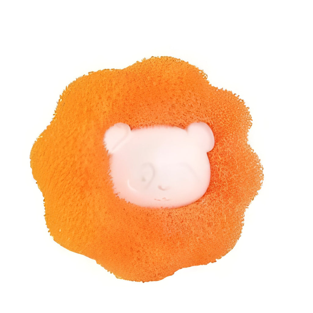 Orange Furloop pet hair remover ball with a white bear-face center